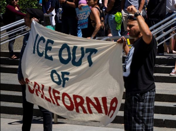 Supporters of California's sanctuary laws demonstrate at the federal courthouse in Sacramento. Photo by Robbie Short for CALmatters