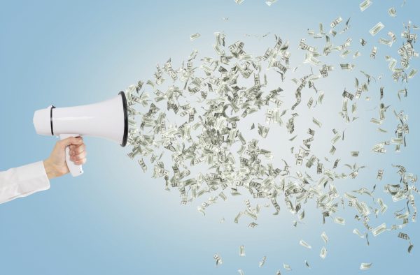 Like a bullhorn, hundreds of millions of campaign dollars are amplifying the message from key industries to California voters.