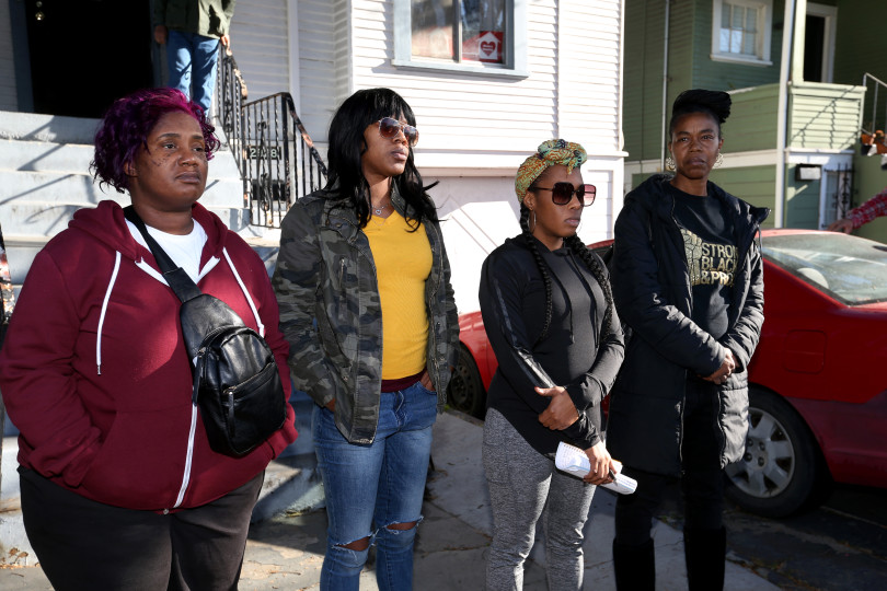Moms 4 Housing members Sharena Thomas, left, Misty Cross, Dominique Walker and Tolani King look on during a press conference outside the house they have occupied on Magnolia Street in Oakland on Friday, Jan. 10, 2020. Photo by Ray Chavez, Bay Area News Group