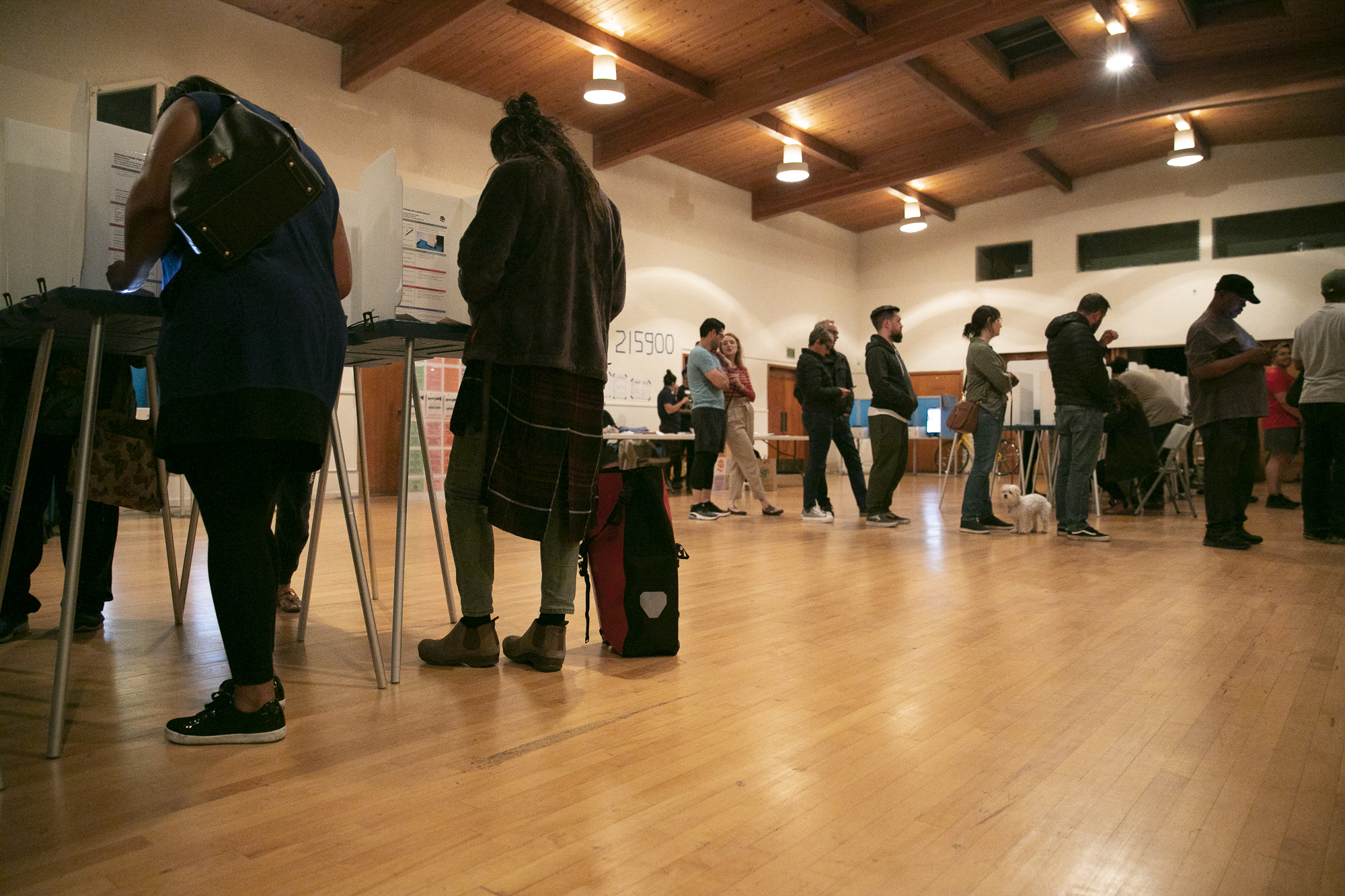 People line up to receive their ballots at BeeBee Memorial Christian Methodist church in Oakland on Super Tuesday 2020. Photo by Anne Wernikoff for CalMatters