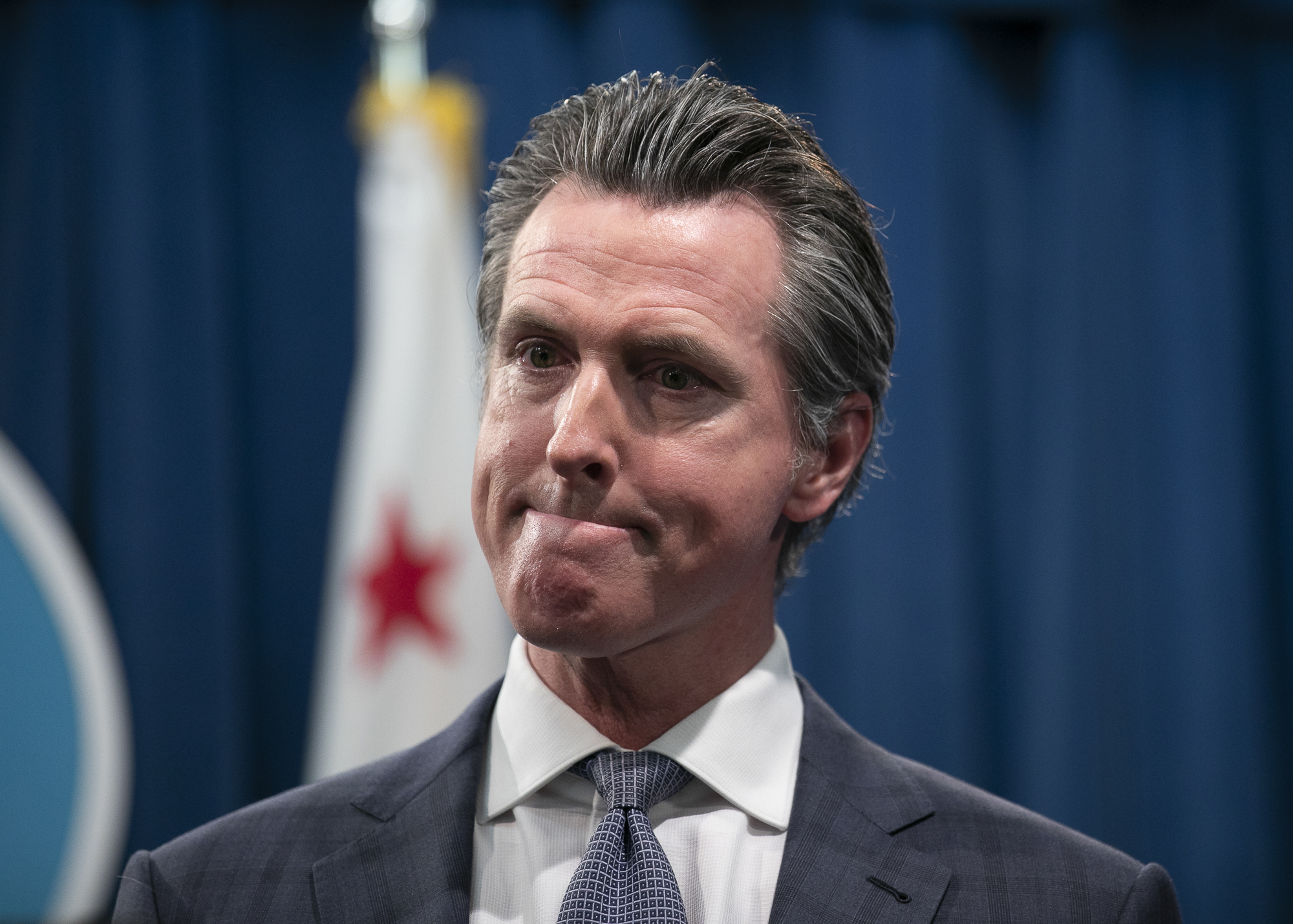 Gov. Gavin Newsom at a press conference in the state capitol following the first COVID-19 death in California. Photo by Anne Wernikoff for CalMatters