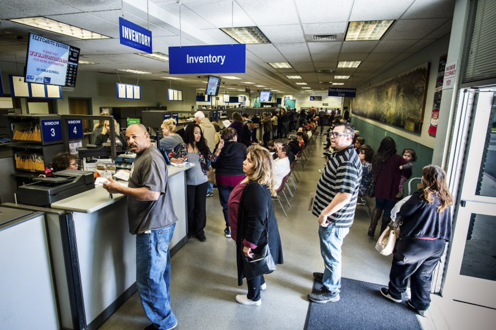 People wait in line to check in at the DMV in Riverside on Friday, March 8, 2019. Photo by Watchara Phomicinda, The Press-Enterprise/SCNG