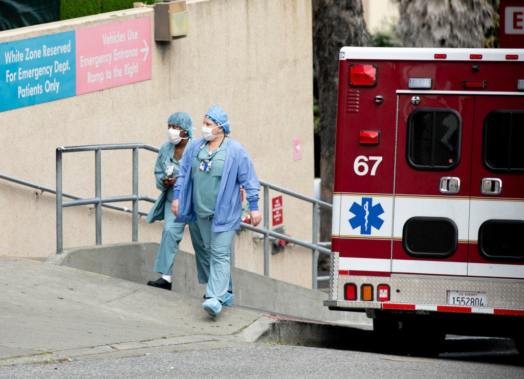 Healthcare workers at a Kaiser hospital in San Francisco on April 9, 2020. Today, Gov. Gavin Newsom announced that the state would make hotel rooms available to care providers in regions with high rates of COVID-19 infections who need to self-isolate. Photo by Anne Wernikoff for CalMatters