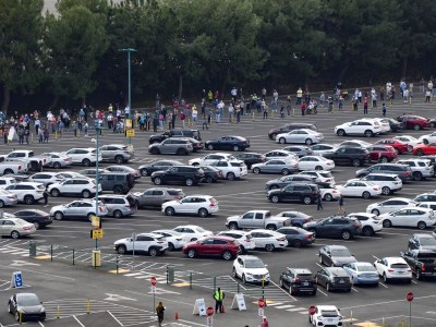 People wait in line at a temporary COVID-19 vaccine super site set up at the north of the Toy Story Parking Lot at the Disneyland Resort in Anaheim on January 13, 2021. Photo by Jeff Gritchen, Orange County Register/SCNG