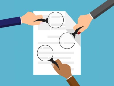 Hands holding magnifying glasses