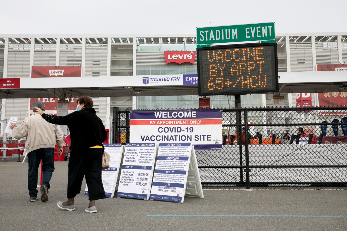 Patients enter Levi’s Stadium to receive Pfizer COVID-19 vaccines on Feb. 9 2021 in Santa Clara. The 49ers arena opened on Tuesday as a vaccine distribution site for Santa Clara County residents 65 and older and is expected to inoculate up to 15,000 people per day once supplies become available. Photo by Anne Wernikoff, CalMatters