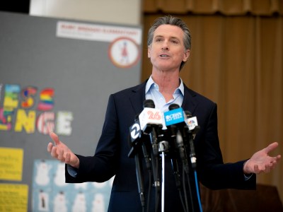 Gov. Gavin Newsom speaks to the press during a visit to Ruby Bridges Elementary School in Alameda on March 16, 2021. "We will fight it. We will defeat it," Newsom said of the recall effort. Photo by Anne Wernikoff, CalMatters