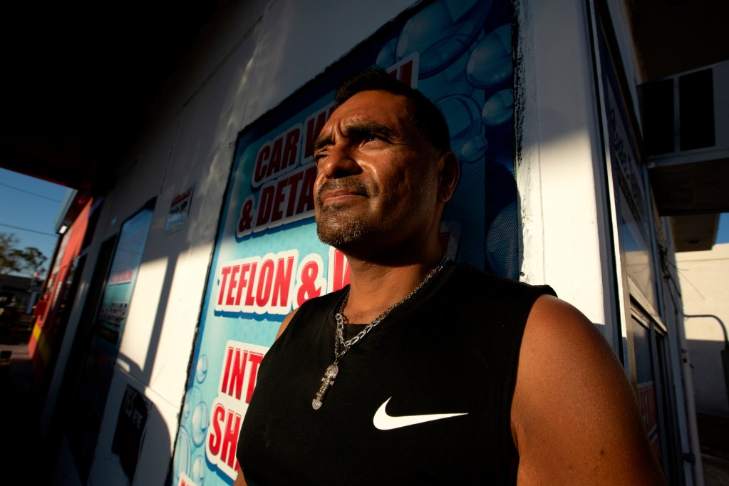 Micheal Torres sits for a portrait inside the auto shop where he works in El Centro on April 29, 2021. Photo by Shae Hammond for CalMatters