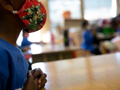 Students wear masks and sit one to a two-person desk in order to social distance during summer classes at Laurel Elementary in Oakland on June 11, 021. Photo by Anne Wernikoff, CalMatters