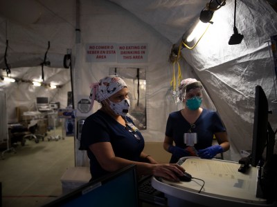 Nurses Karla Salazar, right, and Marisol Perez work in a tent set up to help treat COVID-19 patients at El Centro Regional Medical Center in El Centro on July 21, 2020. Photo by Jae C. Hong, AP Photo