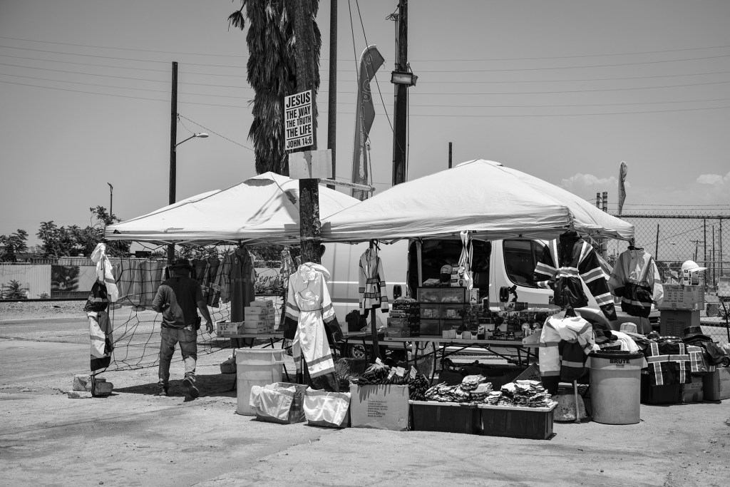 TKTKTKA merchant sells industrial uniforms and safety equipment near refineries off the Pacific Coast Highway in Long Beach. Photo by Pablo Unzueta