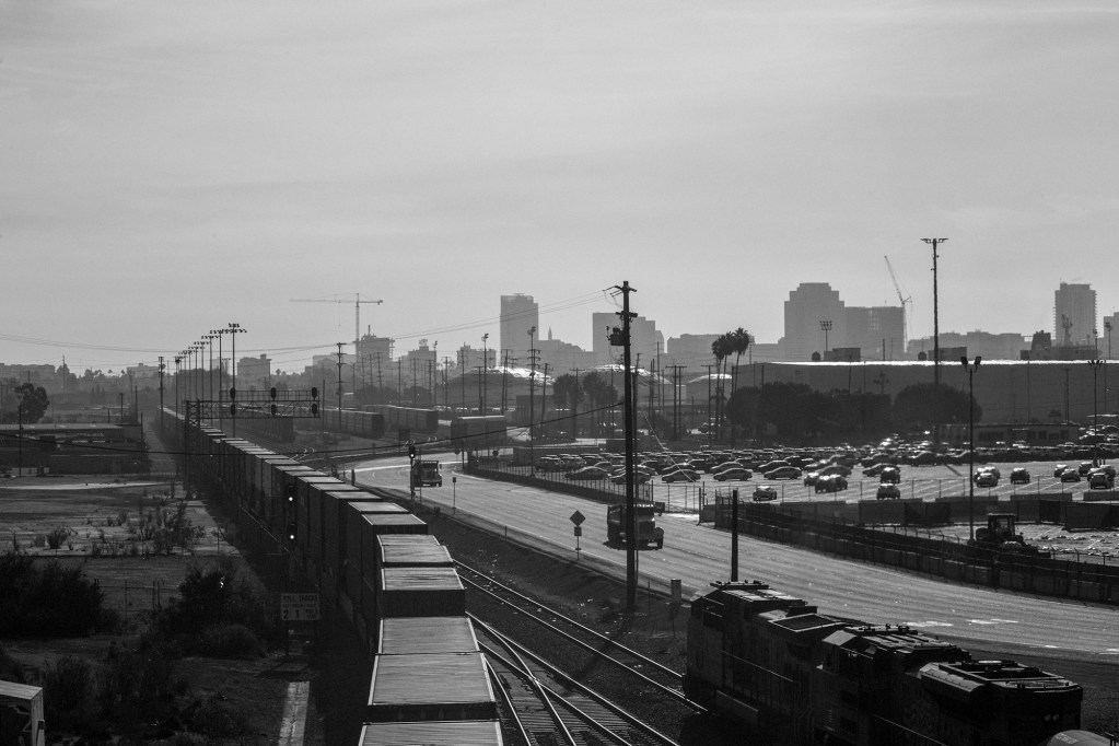 Containers are transported via railway near downtown Long Beach. Photo by Pablo Unzueta
