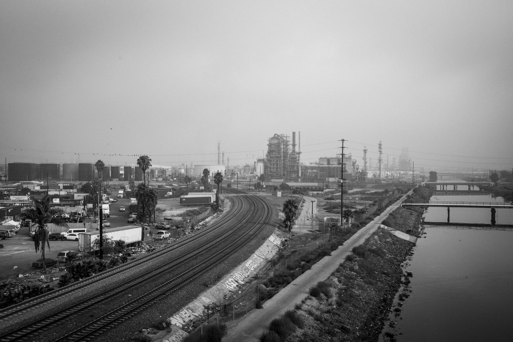 The Dominguez Channel slices through an industrial part of Wilmington. In 2021, a hydrogen sulfide spill occurred in the Dominguez Channel, sickening thousands of residents in Carson and in parts of Long Beach. Photo by Pablo Unzueta