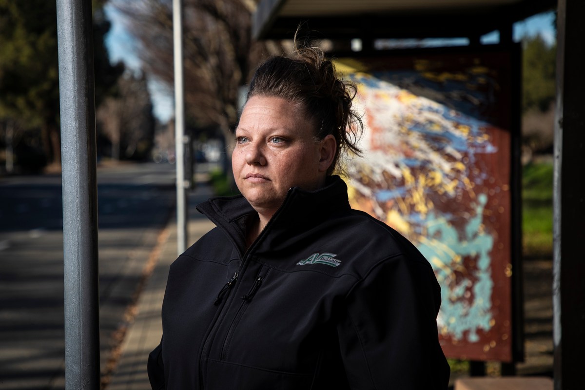 C Transit driver Brandi Donaldson is photographed at a bus stop near her home in Rodeo on Jan. 24, 2022. Photo by Martin do Nascimento/CalMatters