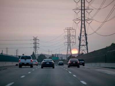 Sunset behind electrical lines outside of Bay Point along Highway 4 on Sept. 15, 2020. Photo by Anne Wernikoff for CalMatters