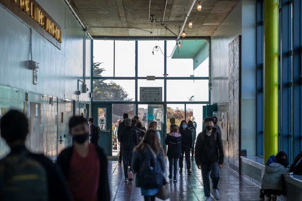 Students walk in the hallways at AP Gianni Middle School in San Francisco on April 22, 2022. Photo by Martin do Nascimento, CalMatters