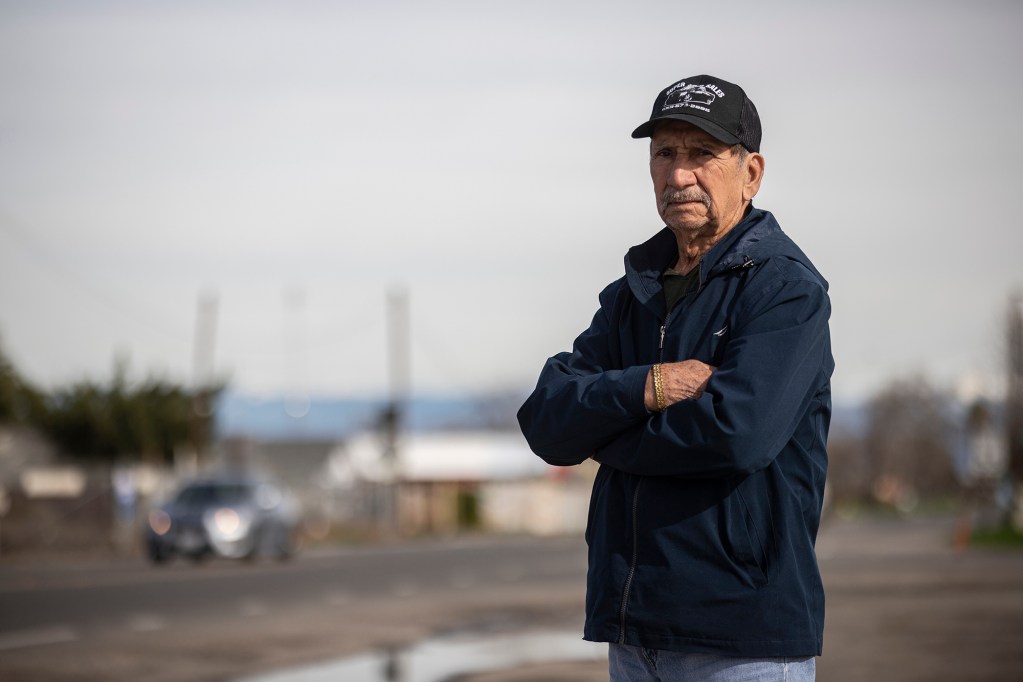 Madera resident 80-year-old Pedro Dominguez standing near a busy street in town on Jan. 12, 2023. Dominguez said the recent closure of the hospital has him concerned for his wife, Elpidia Sanchez de Jesús, who suffers from asthma. Photos by Larry Valenzuela, CalMatters/CatchLight Local