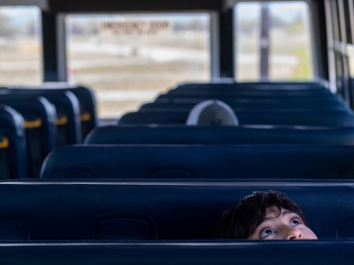 Almarissa Segura, 14, a student at San Antonio Elementary School in Lockwood, looks up while seated on a school bus. She was part of a CatchLight and CalMatters photo project that captured student life during the pandemic in California. Photo by David Rodríguez Muñoz for The Californian, Catchlight and CalMatters