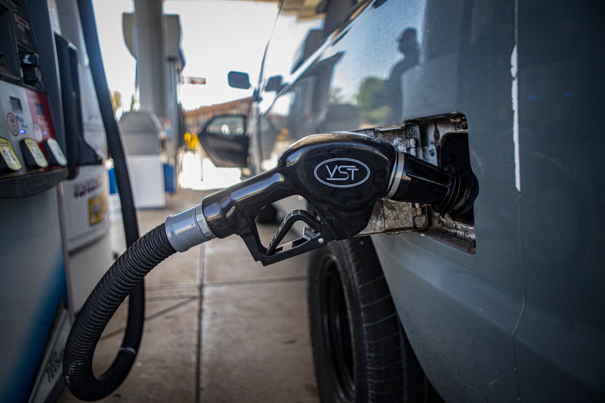 A gas nozzle in a van at a central Fresno gas station on Sept. 29, 2022. Photo by Larry Valenzuela, CalMatters/CatchLight Local