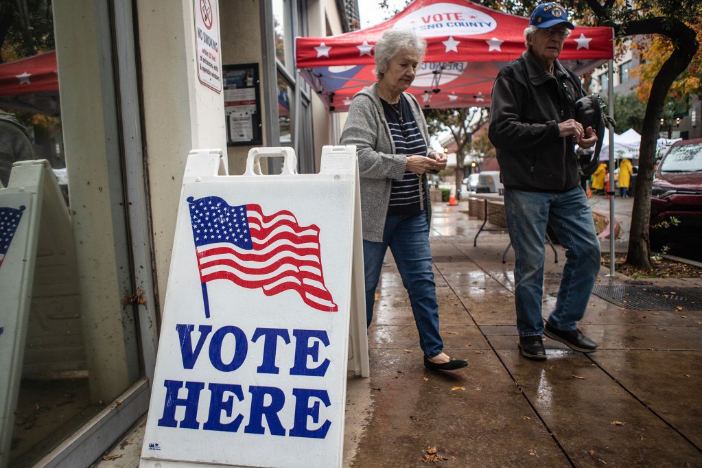 Voters leave the elections office in downtown Fresno after dropping off their ballot for the midterm elections on Nov. 8, 2022. Photo by Larry Valenzuela, CalMatters/CatchLight Local