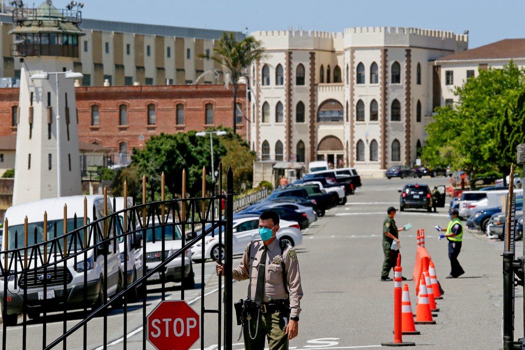 A correctional officer closes the main gate at San Quentin State Prison in San Quentin on July 9, 2020. Photo by Eric Risberg, AP Photo