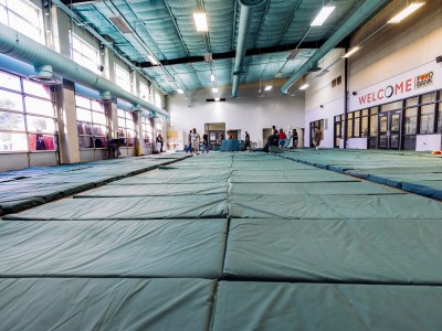 Volunteers prepare for sleeping arrangements at Haven for Hope in San Antonio, Texas on June 26, 2023. The community kitchen sleeps on average 200 clients. Photo by Chris Stokes for CalMatters
