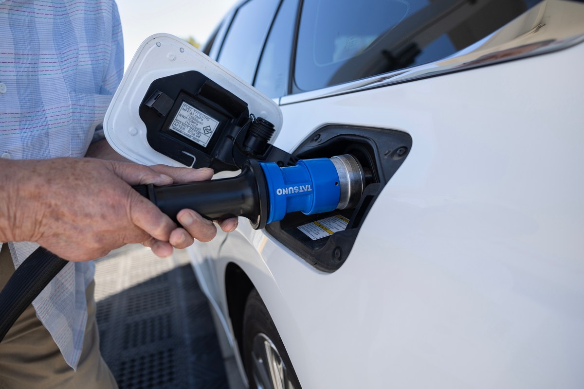 A hydrogen vehicle owner adds fuel to his vehicle at an Iwatani hydrogen fuel station in West Sacramento on July 25, 2023. Photo by Miguel Gutierrez Jr., CalMatters