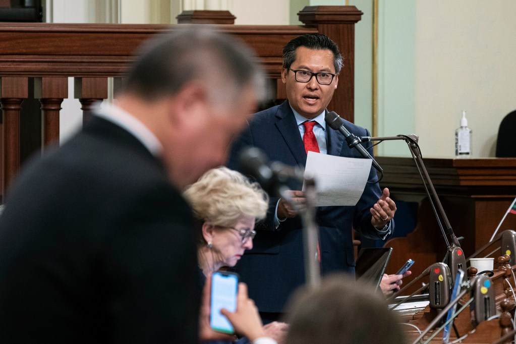 Assemblyman Vince Fong, R-Bakersfield, right, vice chair of the Assembly budget committee, criticizes the state budget plan carried by Assemblyman Phil Ting, D-San Francisco, left, the chair of the budget committee, at the Capitol in Sacramento, June 27, 2023. Photo by Rich Pedroncelli, AP Photo