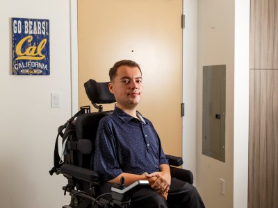 Ryan Manriquez in his apartment building at UC Berkeley on Jan. 10, 2024. Manriquez spoke about his experience with emergency exits as a person with disabilities at a recent UC Regents meeting, prompting the university system leadership to alter its emergency safety plans. Photo by Juliana Yamada for CalMatters
