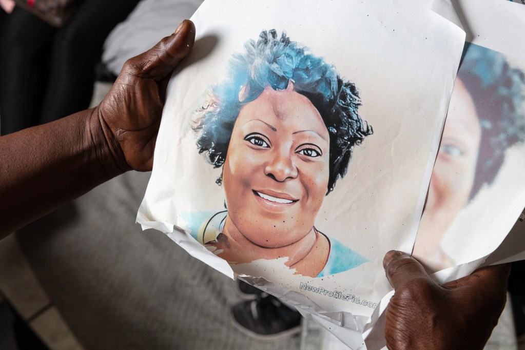 Sharon Jack holds a painting of her daughter, Fredreaka Jack, at her home in Metairie, Louisiana on April 5, 2023. Photo by Cedric Angeles for CalMatters