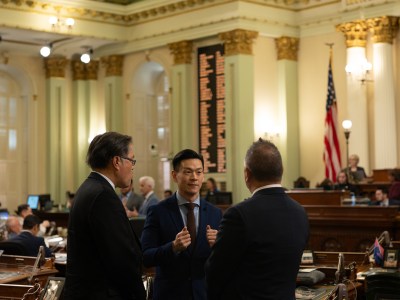 Assemblymember Evan Low speaks with lawmakers on the Assembly floor at the state Capitol in Sacramento on April 29, 2024. Photo by Miguel Gutierrez Jr., CalMatters