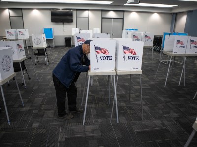Resident Gene Mabray fills out a ballot at a voting center at the Health and Wellness Center in Fresno on March 5, 2024. Photo by Larry Valenzuela, CalMatters/CatchLight Local