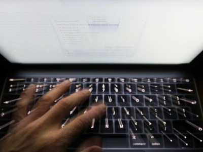 A person using a computer. Photo by Yui Mok, PA via AP Images