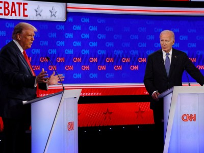 Democrat presidential candidate U.S. President Joe Biden listens as Republican presidential candidate and former U.S. President Donald Trump speaks during their debate in Atlanta, Georgia, on June 27, 2024. Photo by Brian Snyder via Reuters